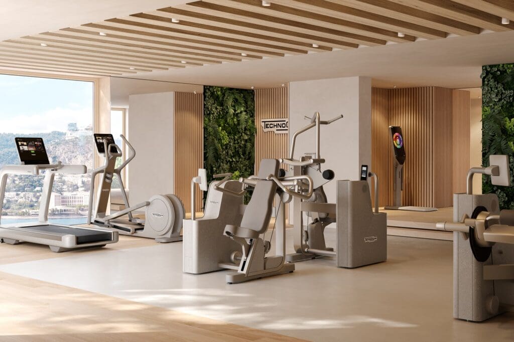 Espaço fitness de luxo com equipamentos Technogym Artis Luxury, design contemporâneo e vista panorâmica.