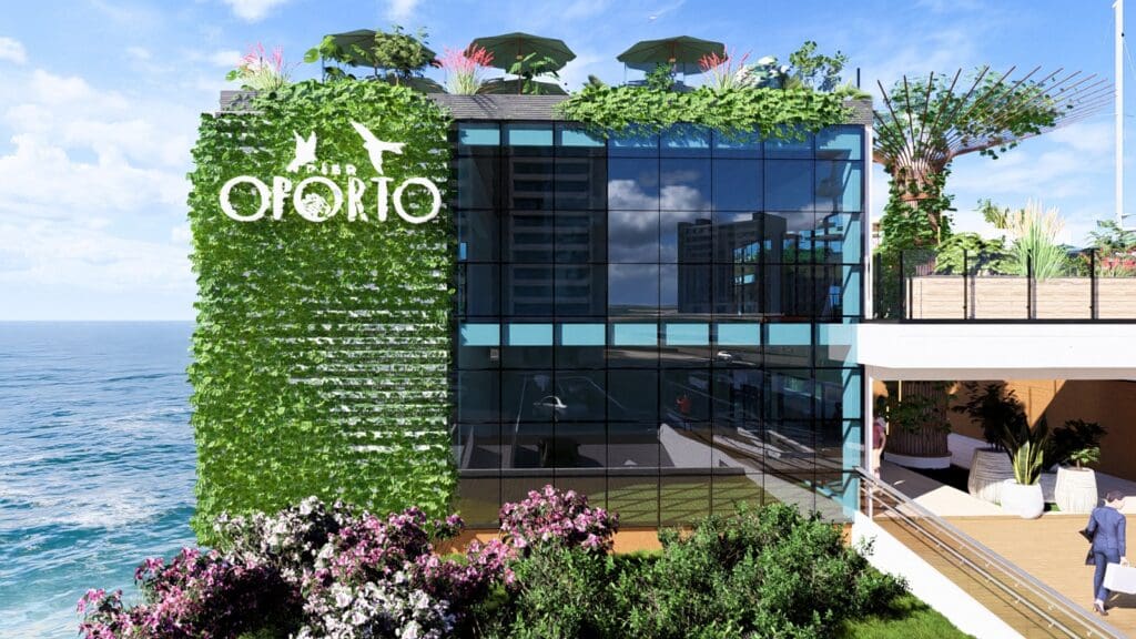 : Fachada envidraçada do Píer Oporto com jardim vertical e vista para o mar, destacando integração entre natureza e arquitetura moderna.
