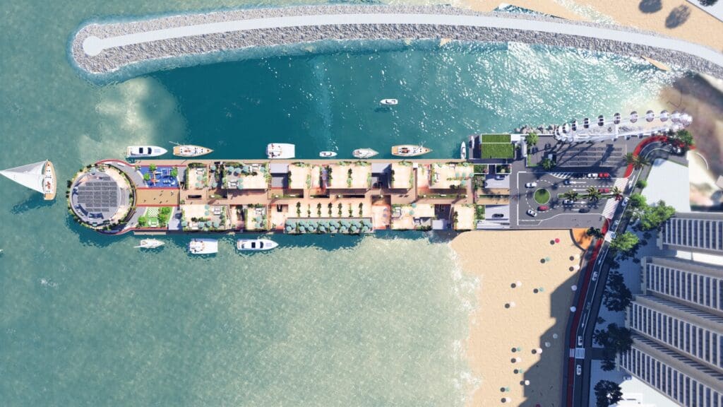 Vista aérea do Píer Oporto em Itapema, destacando o Hard Rock Cafe sobre o mar, áreas comerciais, embarcações e integração com a praia.