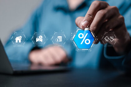 Businessman interacting with digital tax and finance icons on a transparent screen, representing new fiscal documentation and tax reform in the construction sector. Imagem Ilustrativa criada pela Equipe C3.