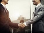 Corporate businessmen shaking hands
